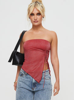 Front view of model wearing  front Princess Polly Sleeveless Asymmetric Neckline  Dessy Strapless Top Red Glitter