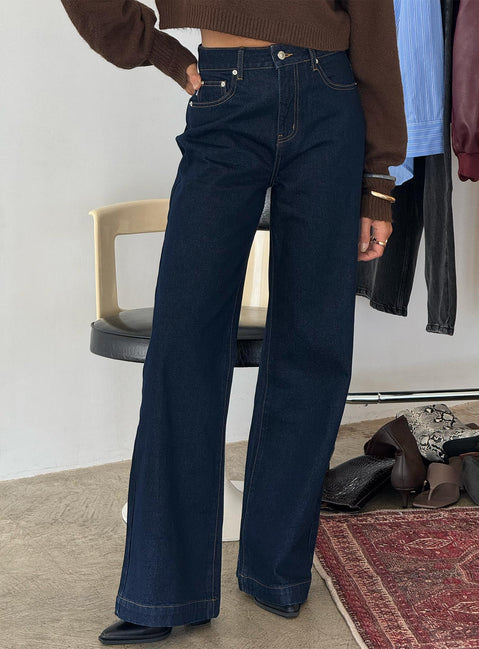 back view of model wearing Princess Polly Goldie High Rise Wide Leg Jeans Indigo High Rise Jeans Jeans 
