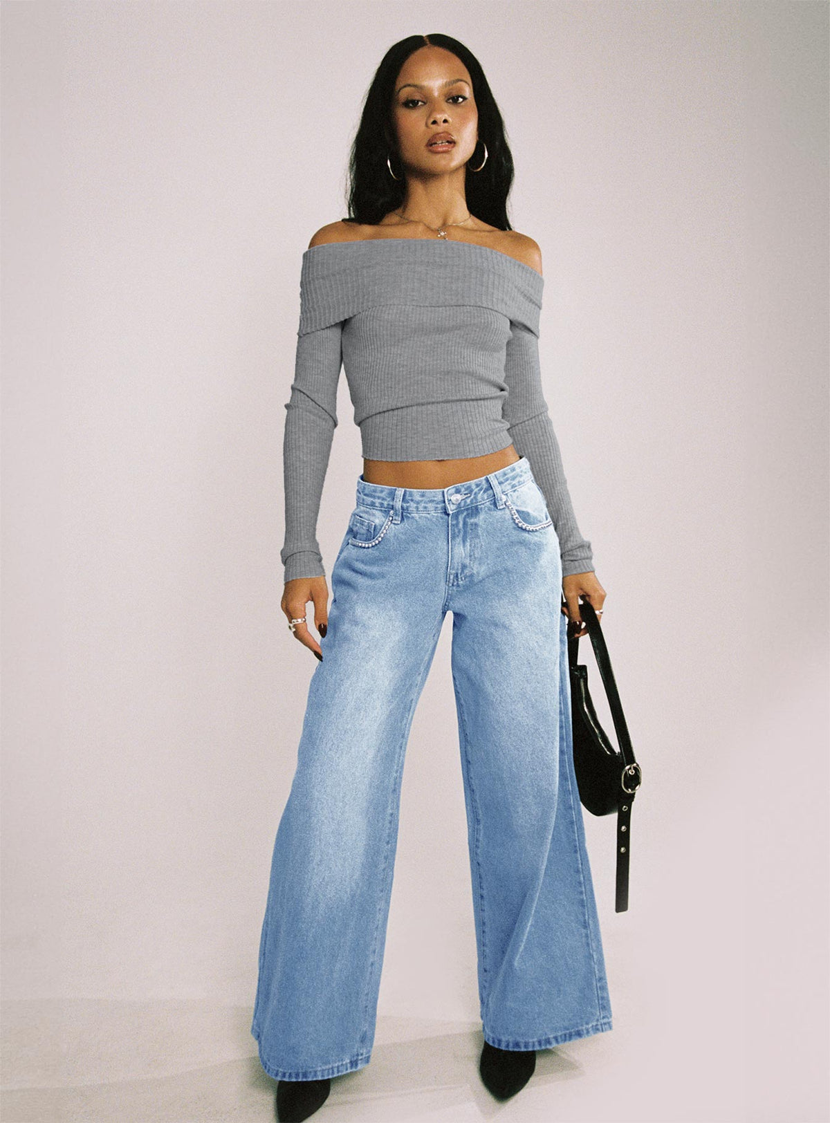 side view of model wearing Princess Polly Pearlisle Low Rise Baggy Jeans Light Wash Low Rise Jeans Jeans 
