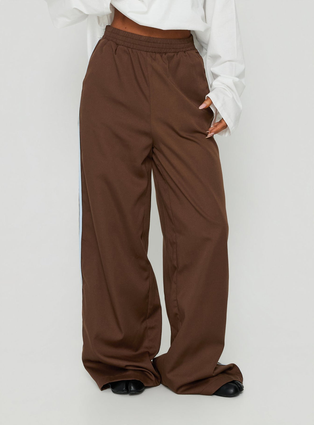 Introducing the Fielder Track Pants Brown / Blue womens-regular-pants featuring high-rise detail Princess Polly