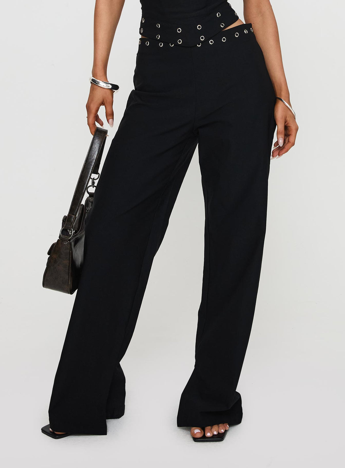 back view of model wearing Princess Polly Passionette Pants Black Petite High Rise Pants Pants 