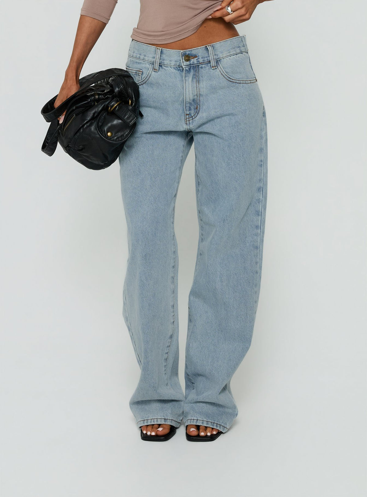 Featuring Totti Jean Washed Blue womens-jeans with low-rise front view of model wearing Princess Polly