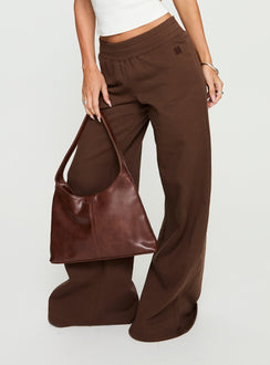 back view of model wearing Princess Polly Summits Flared Track Pants Chocolate High Rise Pants Pants 