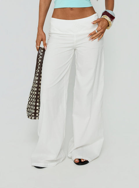 Showcasing Slow Days Broderie Anglais Mid Rise Pants White womens-regular-pants with mid-rise detail view of model wearing Princess Polly