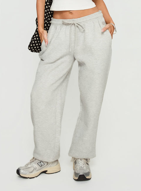 back view of model wearing Princess Polly Caspa Dream Fleece Oversized Ankle Cuff Jogger Grey Marle High Rise Pants Pants 