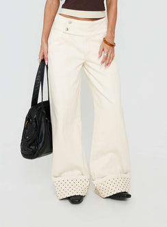 Featuring the Nikoletta Foldover Jeans Cream / Polka Petite womens-jeans in high-rise front view of model wearing Princess Polly