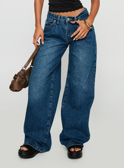 side view of model wearing Princess Polly Duster Mid Rise Baggy Jeans Dark Wash Mid Rise Jeans Jeans 