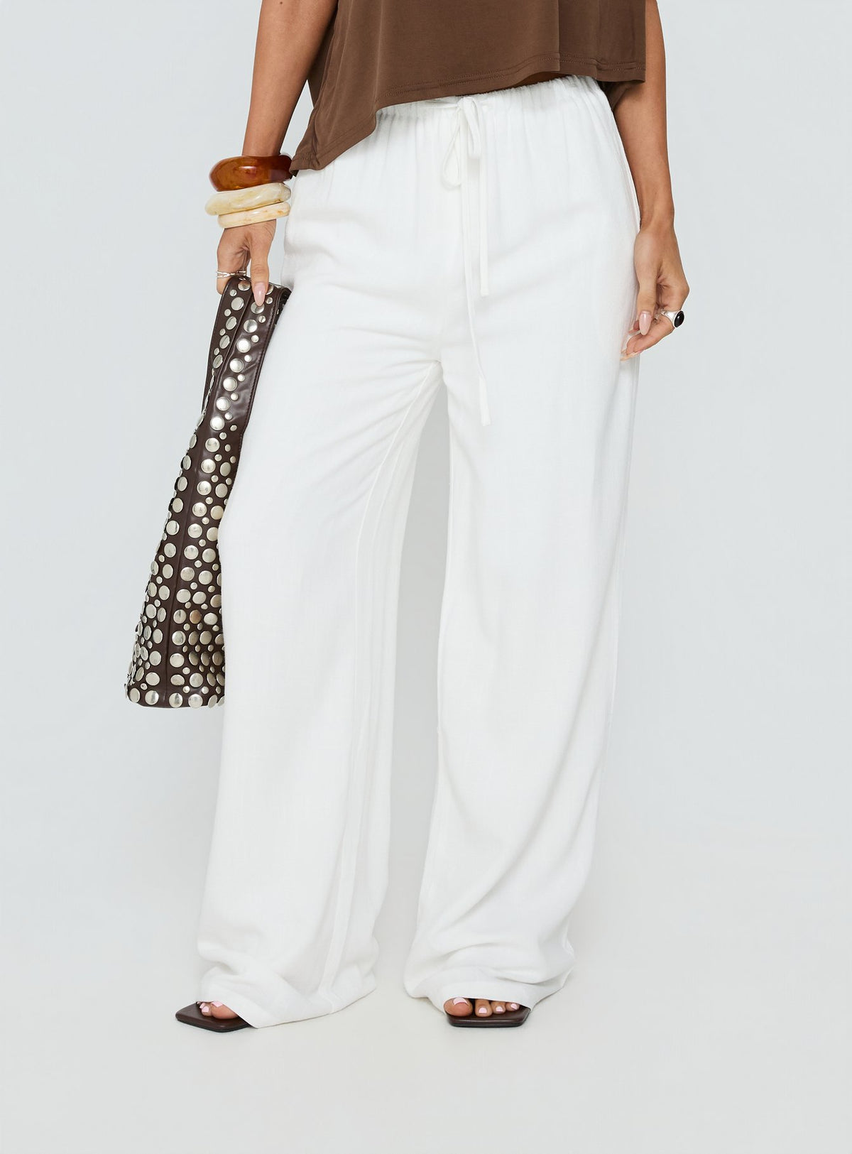 Crafted from the Parklea Pants White Petite in womens-regular-pants with high-rise waist side view of model wearing Princess Polly