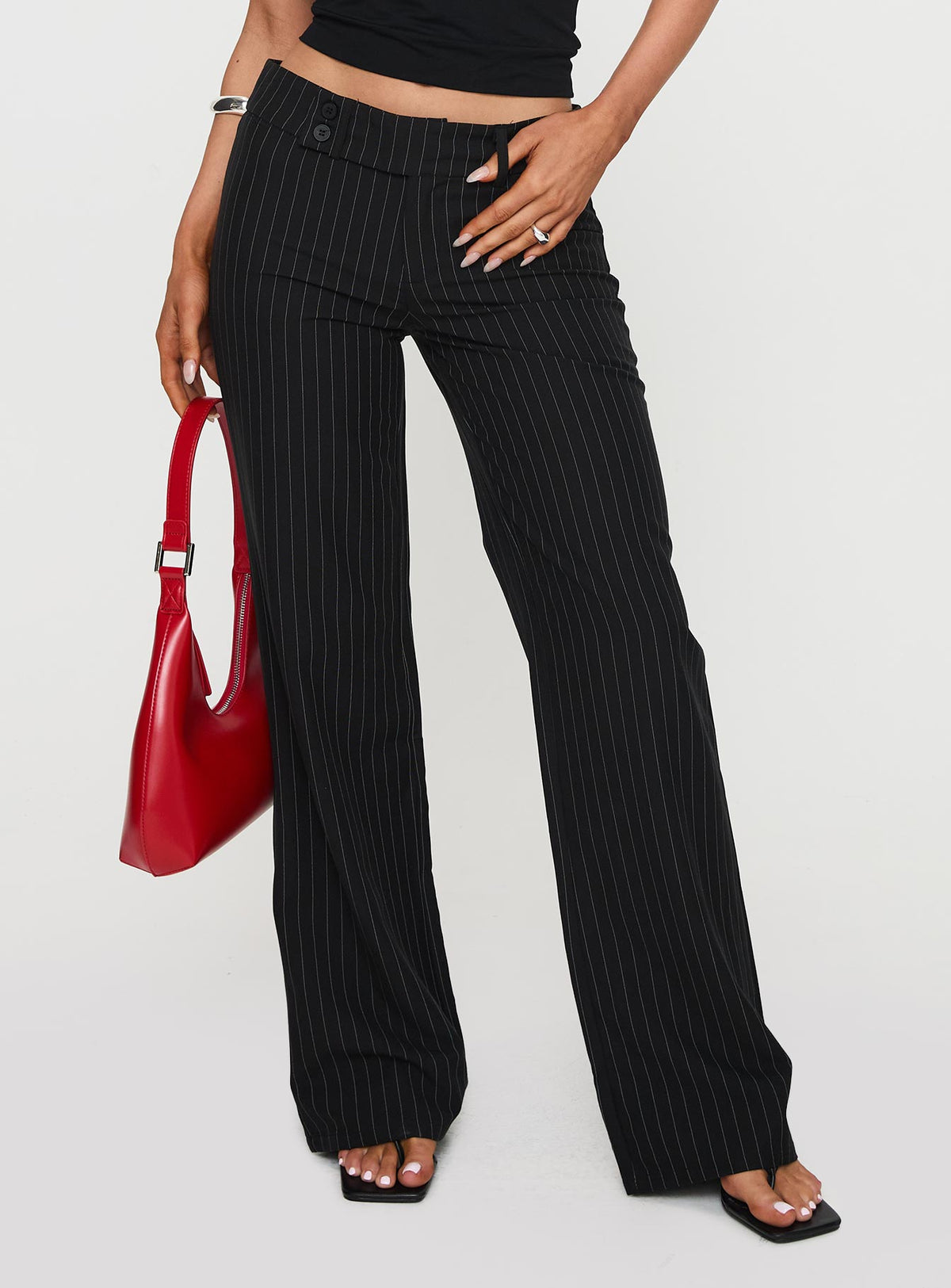 side view of model wearing Princess Polly Socialista Pinstripe Pant Black Low Rise Pants Pants 