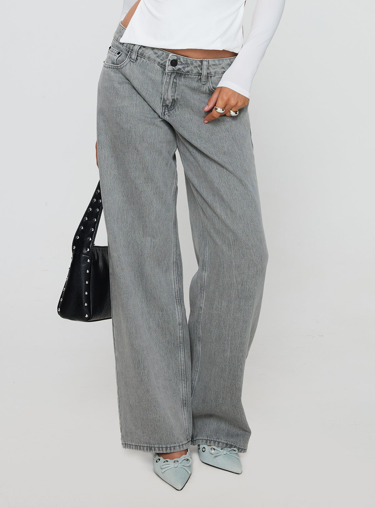 side view of model wearing Princess Polly Ellanor Low Rise Straight Leg Jeans Washed Grey Petite Low Rise Jeans Jeans 