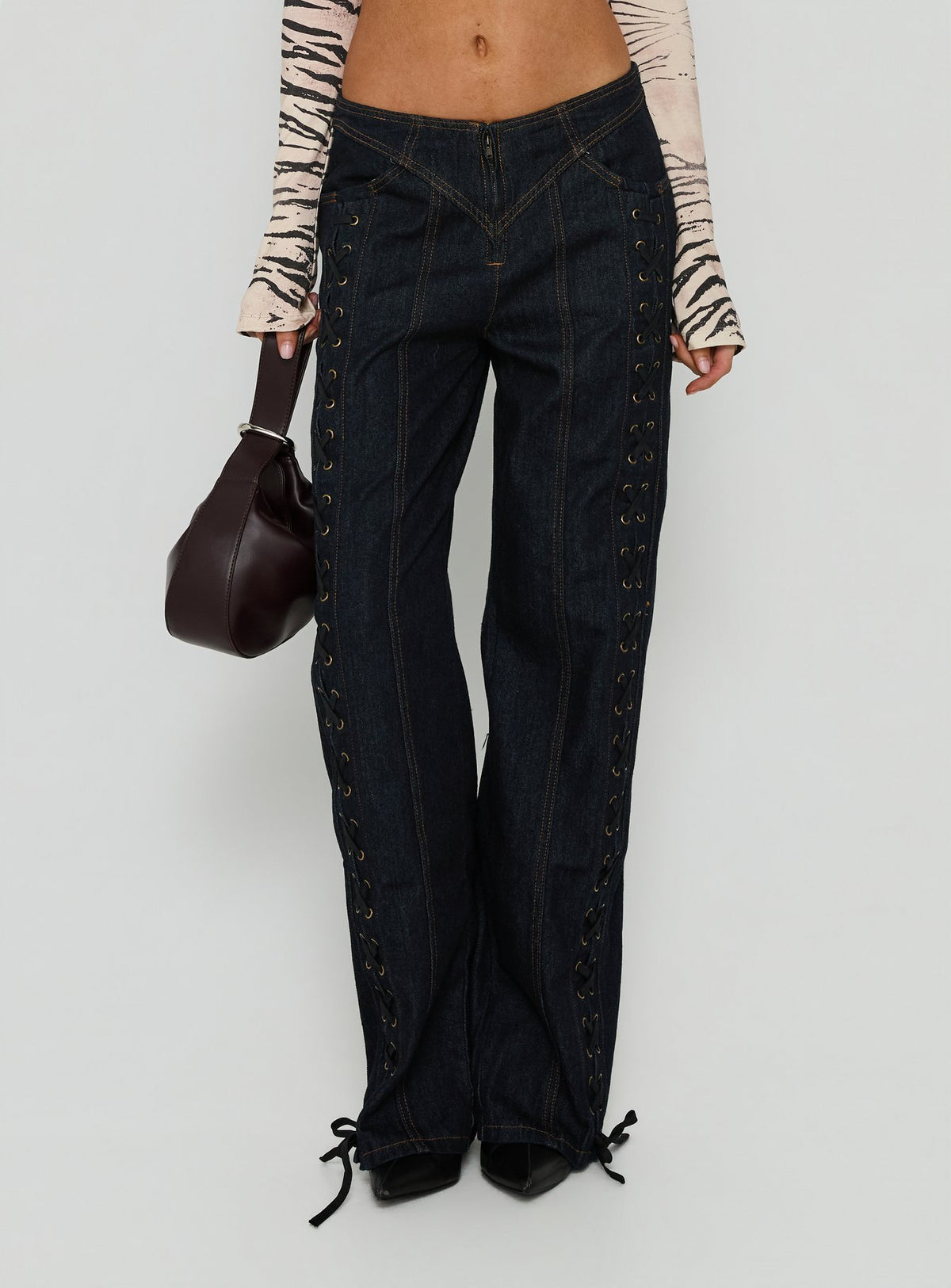 Featuring the Daydream Tie Up Jeans Dark Denim womens-jeans in low-rise product Princess Polly