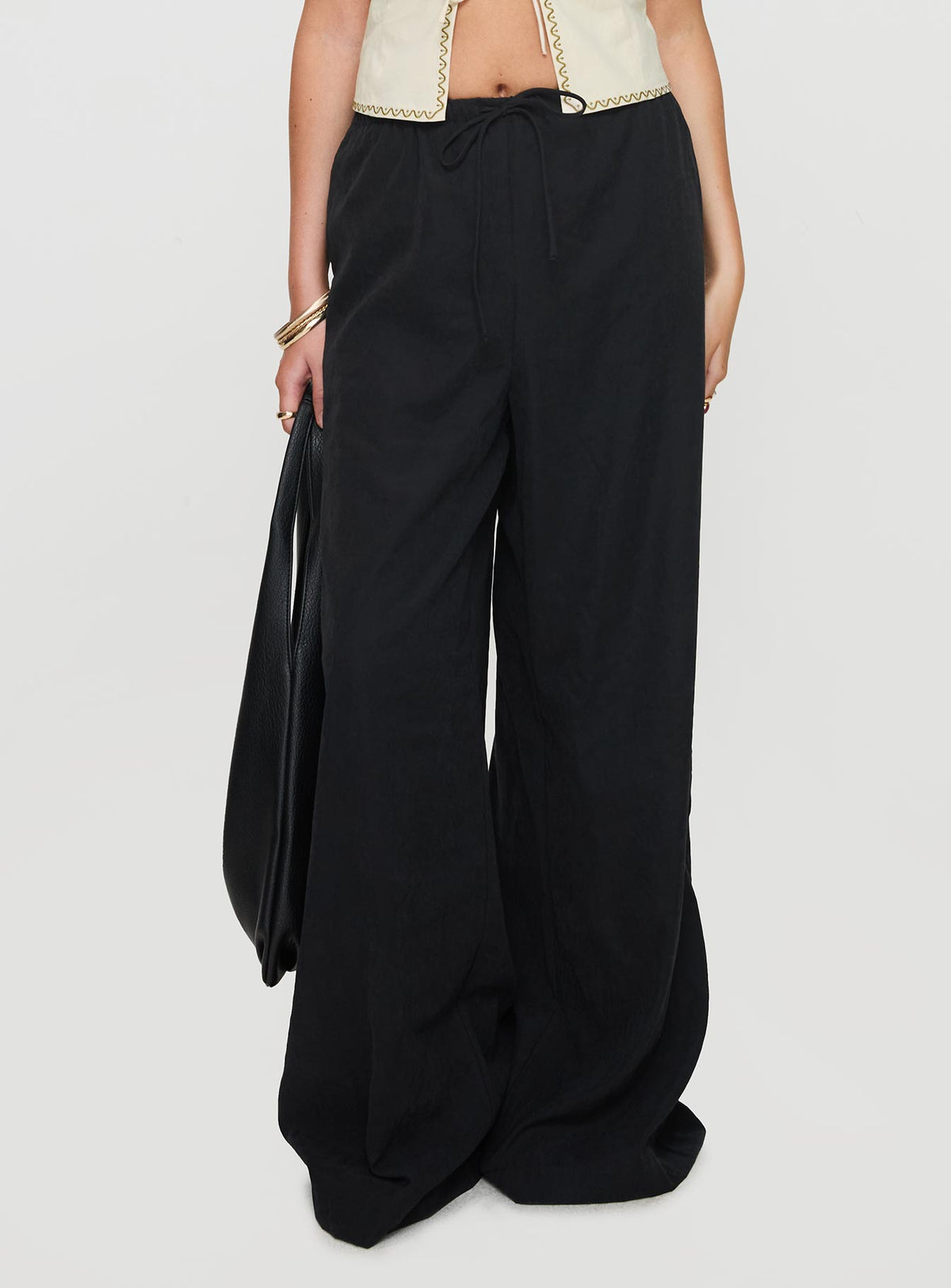 side view of model wearing Princess Polly Barbieri Pants Black High Rise Pants Pants 