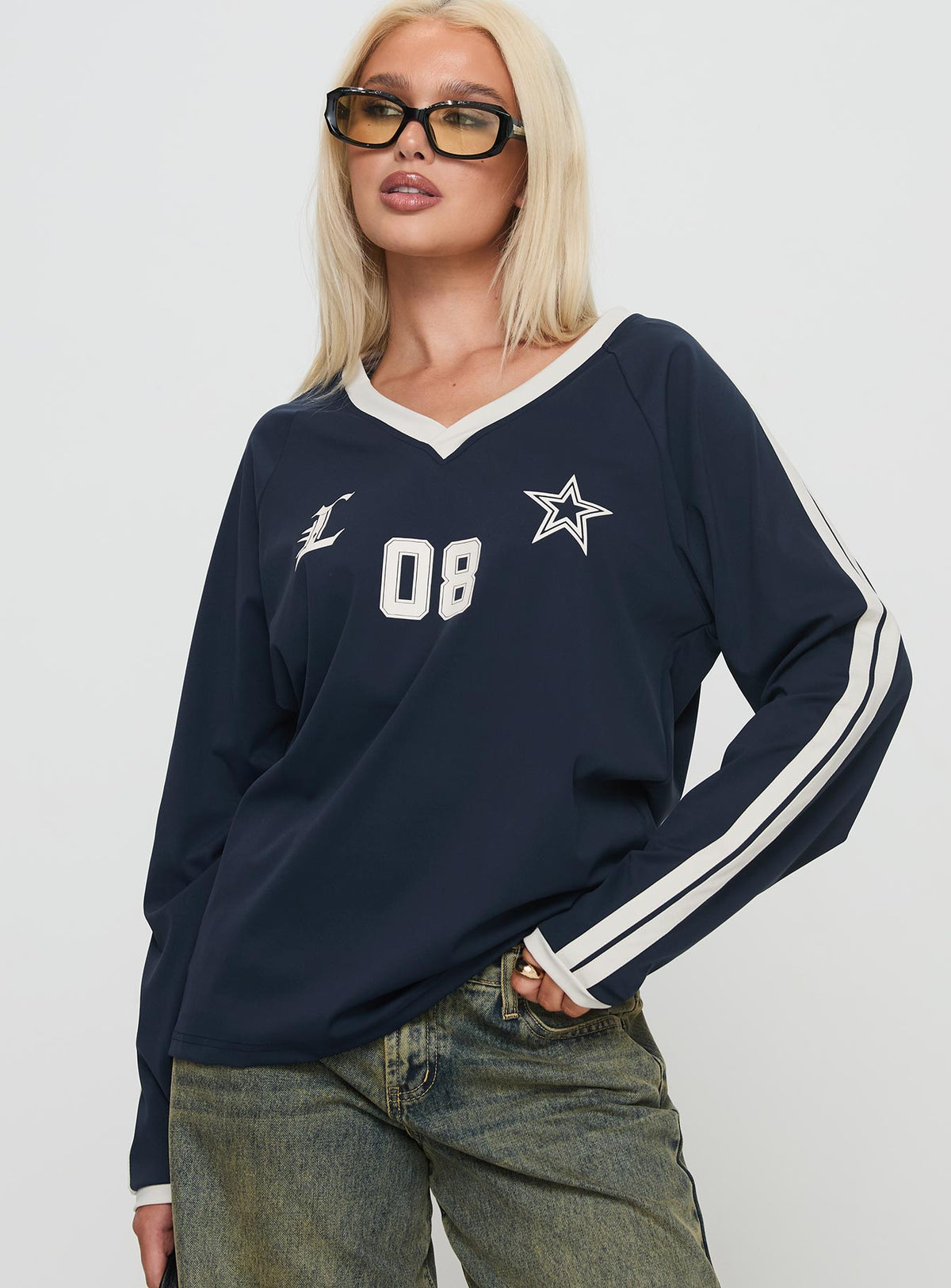front view of model wearing Princess Polly Spectate Top Long Sleeve Navy Full Sleeves V-Neck 