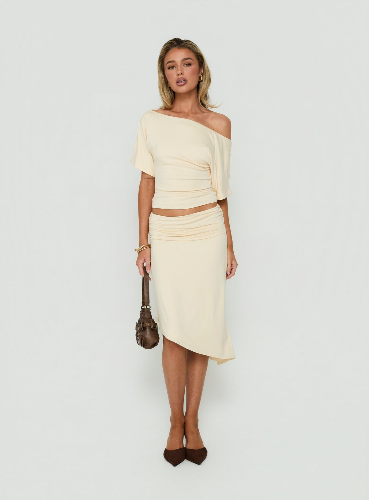 Featuring the Sezzia Ruched Asymmetrical Midi Skirt Beige womens-skirts with fitted silhouette and length detail Princess Polly