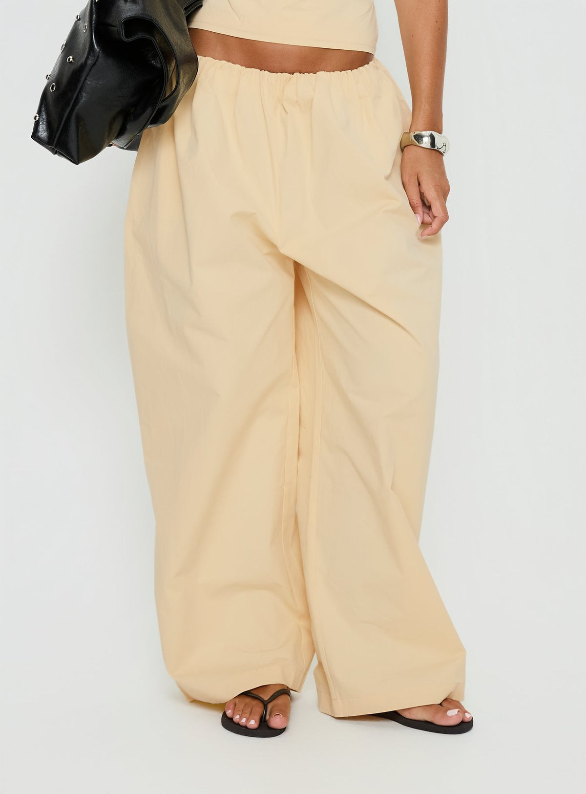 side view of model wearing Princess Polly Tidekiss Pants Lemontini Mid Rise Pants Pants 