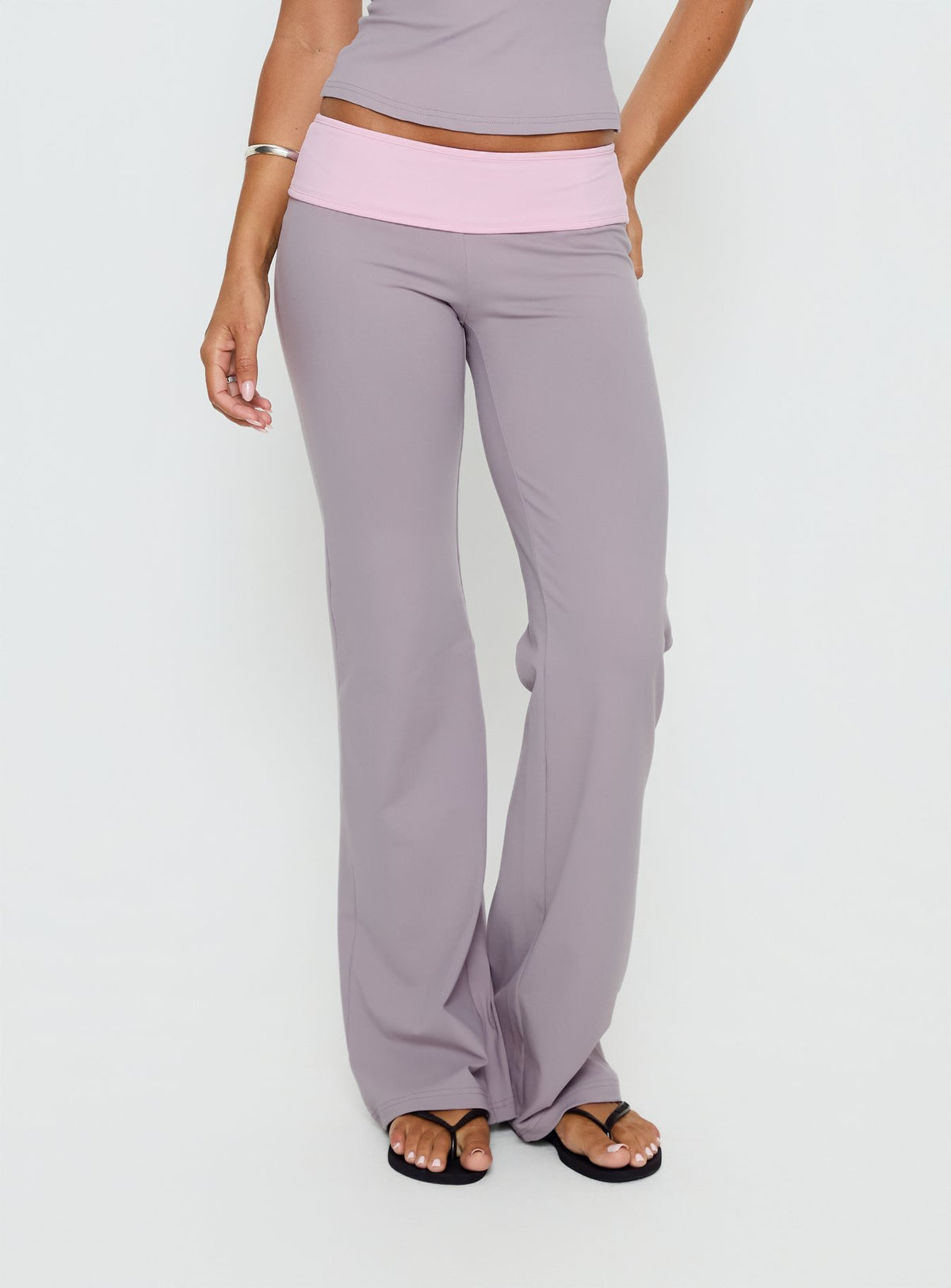 back view of model wearing Princess Polly Kobee Jersey Flare Pants Slate / Dusty Pink Mid Rise Pants Pants 