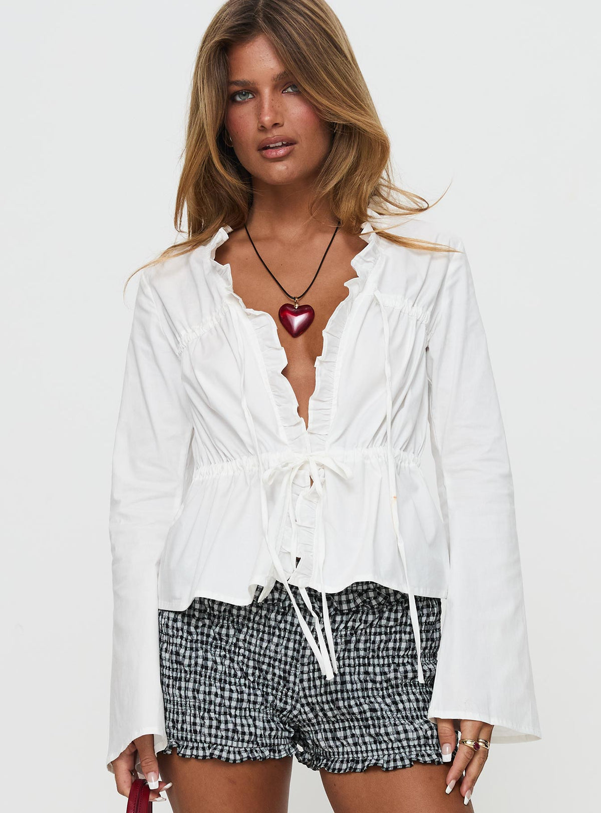 front view of model wearing Princess Polly Harloe Ruched Tie Up Long Sleeve Top White Full Sleeves V-Neck 