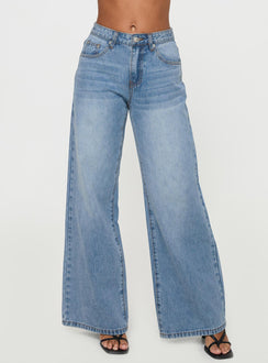 side view of model wearing Princess Polly Colemane Mid Rise Flared Jeans Angel Blue High Rise Jeans Jeans 