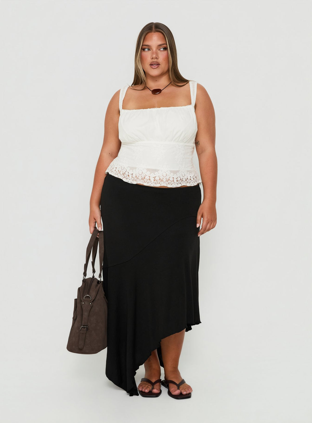 Showcasing the Futura Asymmetrical Midi Skirt Black Curve in womens-skirts with midi length Princess Polly