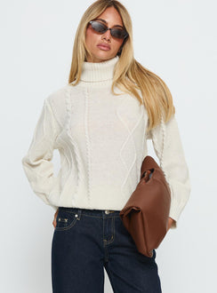 front view of model wearing Princess Polly Tarynne Cable Knit Turtle Neck Sweater Beige Longline Jumpers Jumpers 