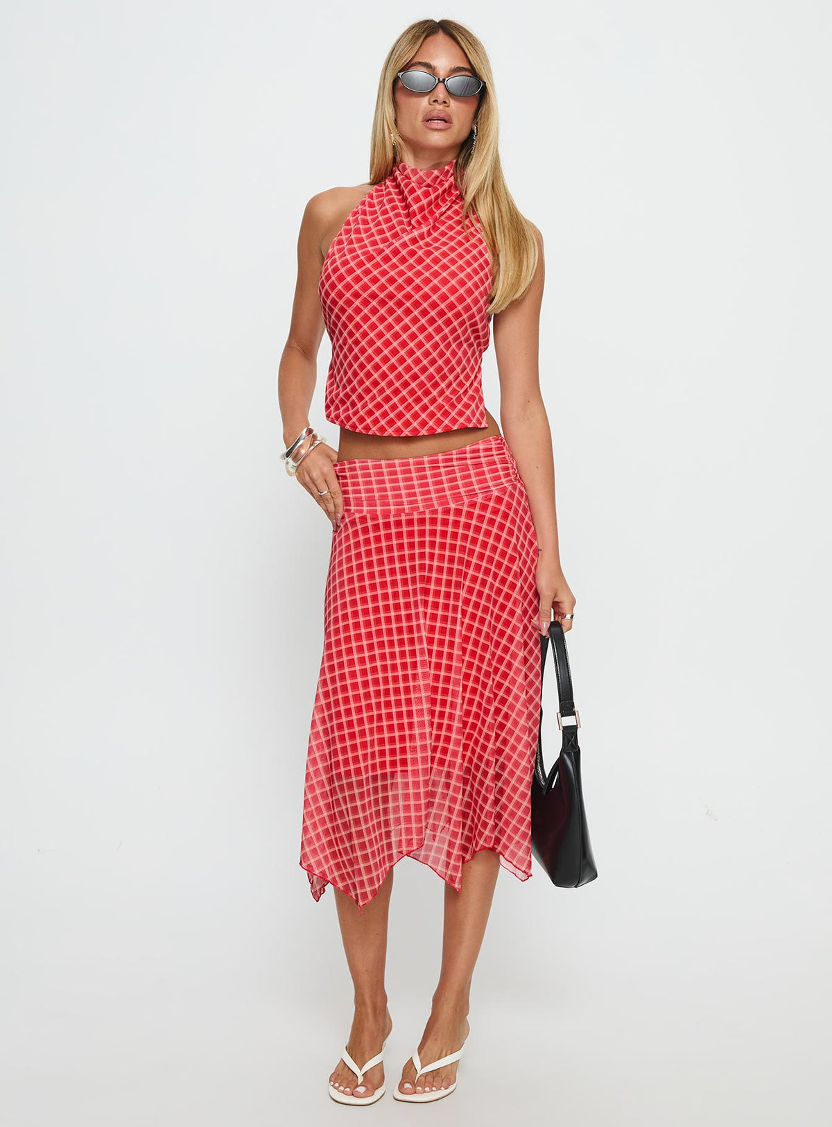  side view of model wearing Princess Polly Scenic Route Asymmetrical Midi Skirt Red Check Midi Skirts Skirts 