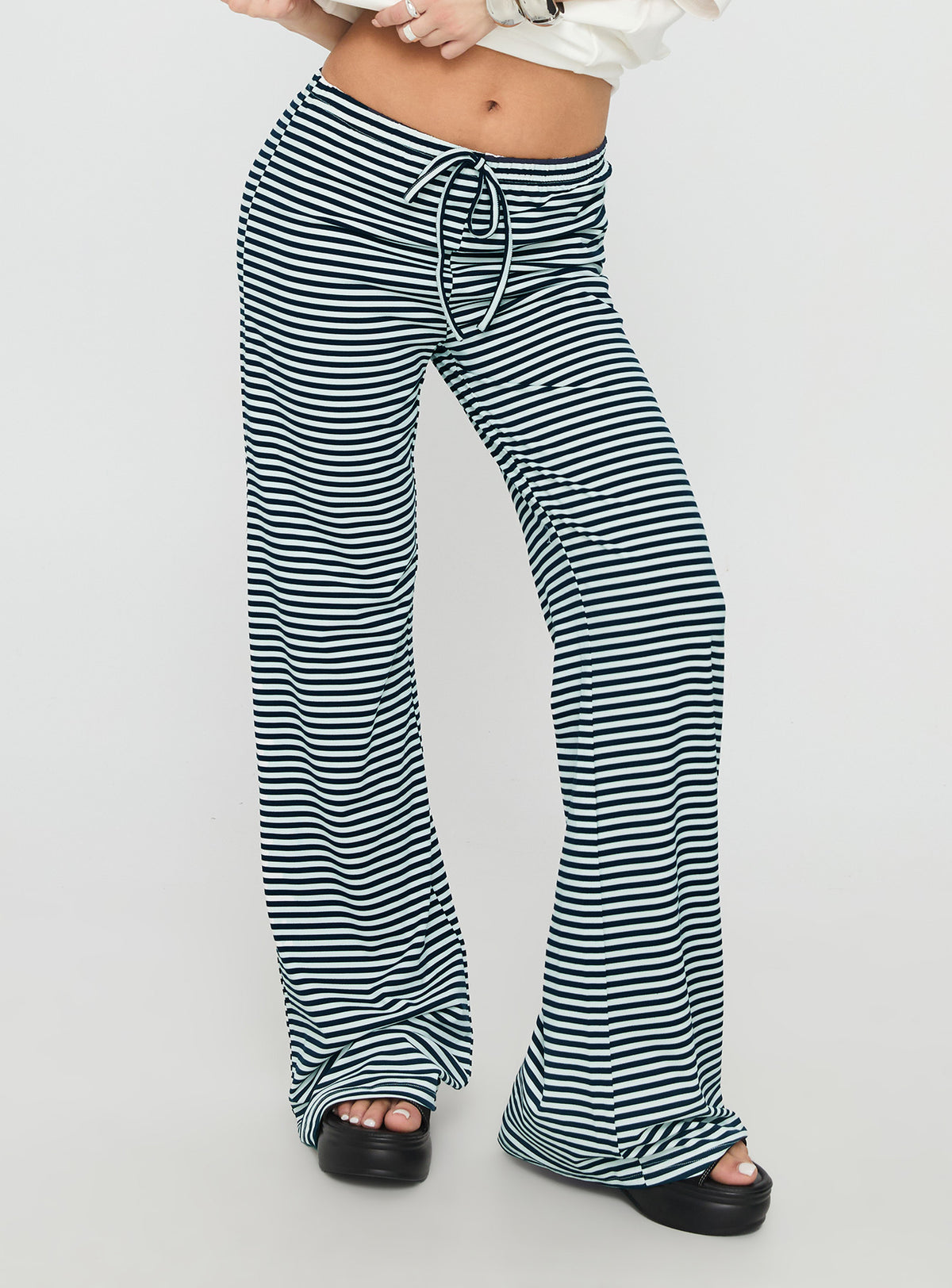 side view of model wearing Princess Polly Alfreda Jersey Pants Navy Stripe High Rise Pants Pants 