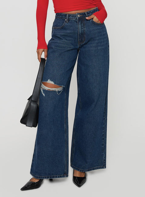 side view of model wearing Princess Polly Naylor Rip Mid Rise Wide Leg Jeans Dark Blue Wash Mid Rise Jeans Jeans 