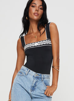 side view of model wearing Princess Polly Keating Bodysuit Black Tall Sleeveless Bodysuit 