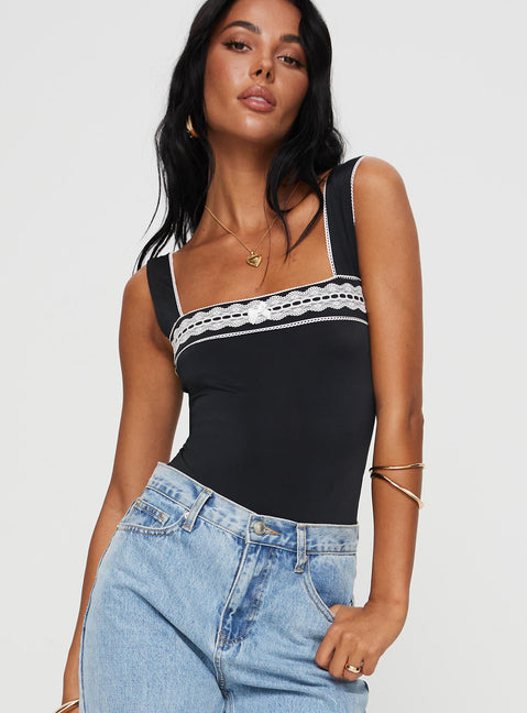 side view of model wearing Princess Polly Keating Bodysuit Black Tall Sleeveless Bodysuit 