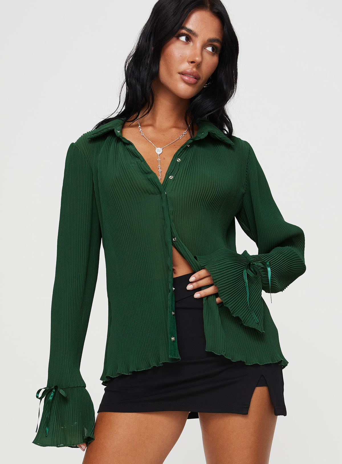 front view of model wearing Princess Polly Ravil Shirt Forest Green Full Sleeves V-Neck 