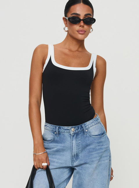 front view of model wearing Princess Polly Astrea Bodysuit Black / White Sleeveless Bodysuit 