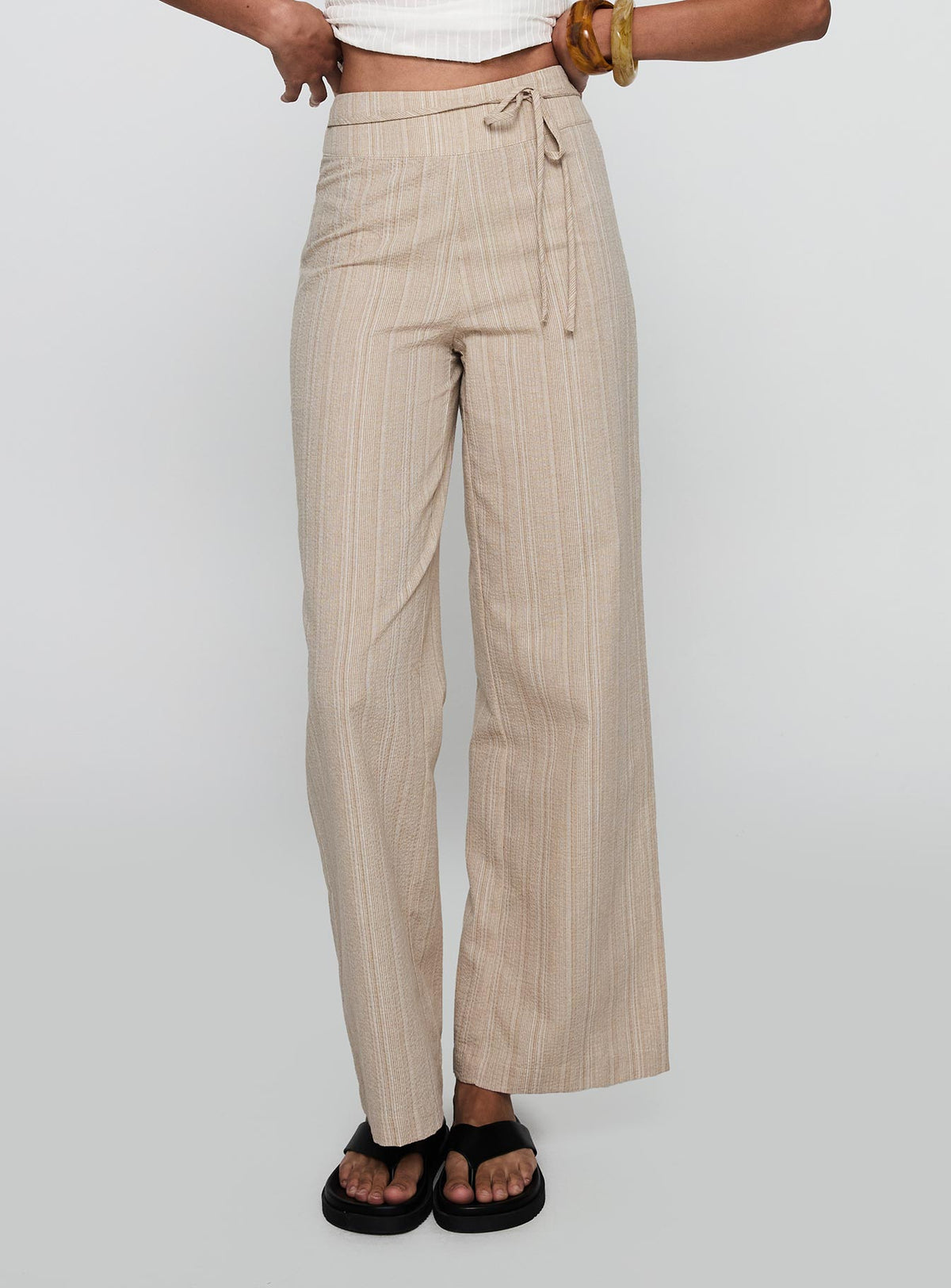 back view of model wearing Princess Polly Rush Hours Tie Up Pants Beige Pants 