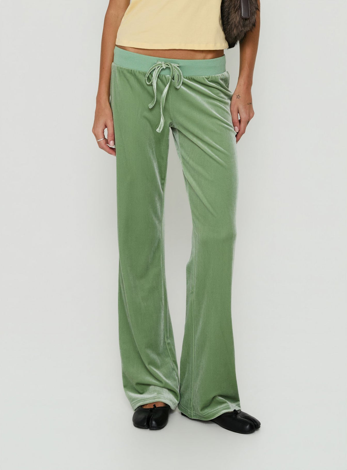 Featuring the Alba Track Pant Sage womens-regular-pants with mid-rise and wide-leg design Princess Polly
