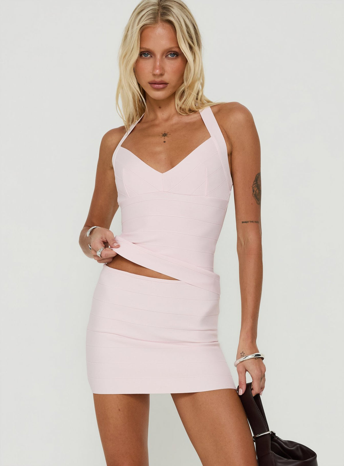 Showcasing the Justina Bandage Mini Skirt Pink in womens-skirts with mini length front view of model wearing Princess Polly
