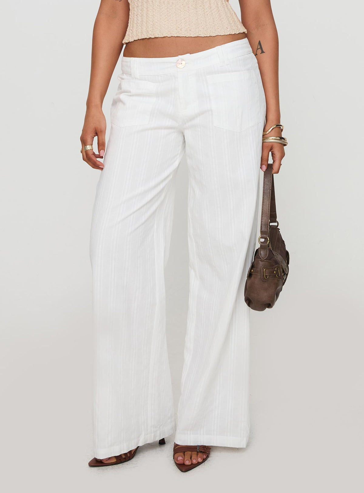front view of model wearing Princess Polly Vendi Low Rise Pant White Low Rise Pants 