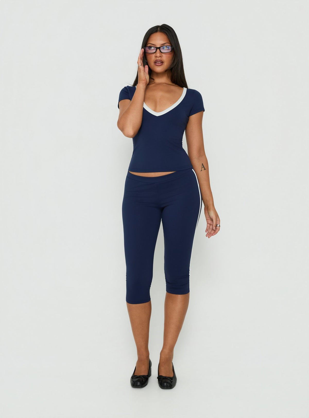 Experience the Rowanna Sporty Capri Pants Navy / Cream womens-regular-pants with high-rise front view of model wearing Princess Polly
