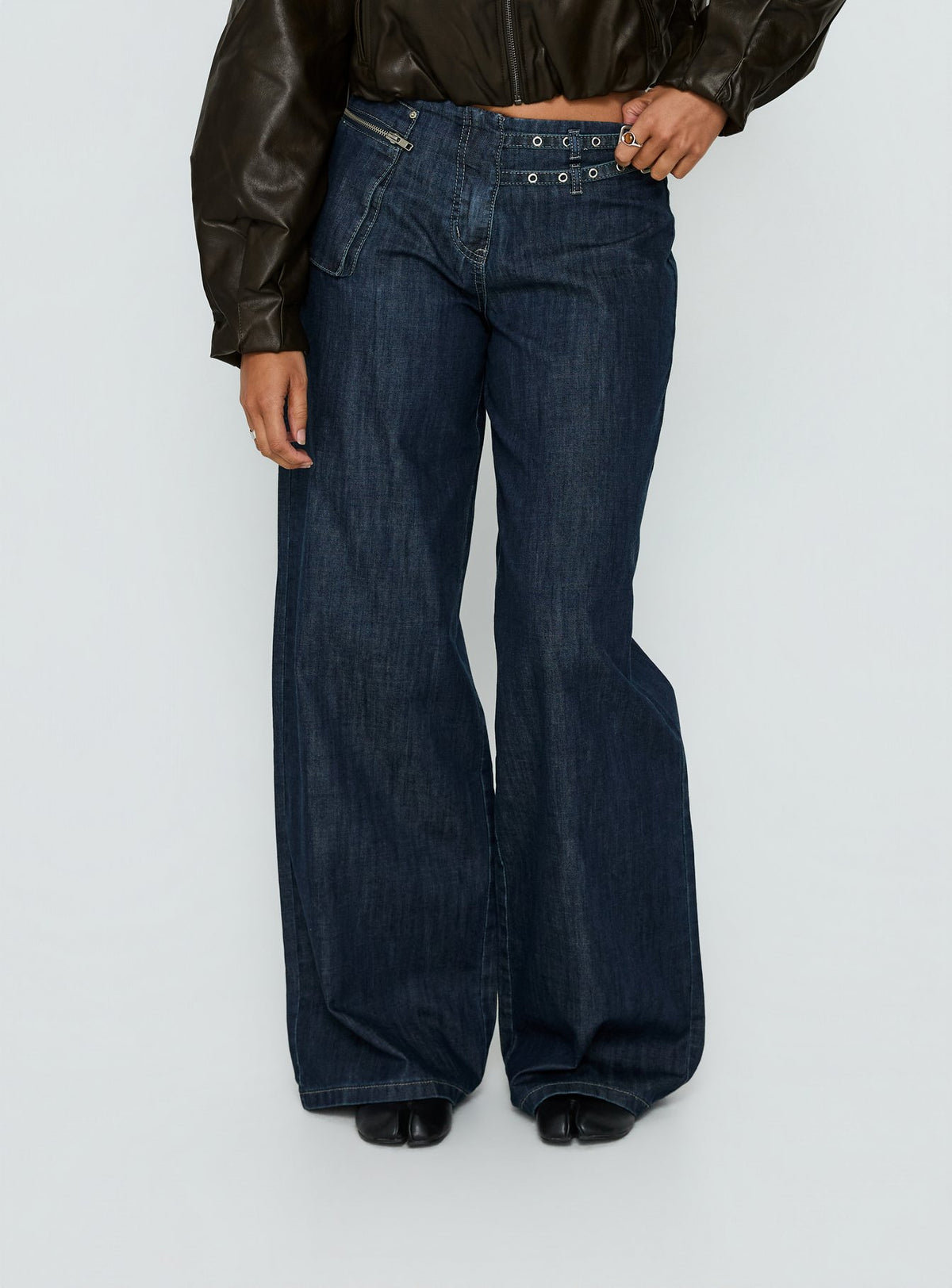 back view of model wearing Princess Polly Paltrow Mid Rise Wide Leg Cargo Jeans Dark Blue Wash Mid Rise Jeans Jeans 