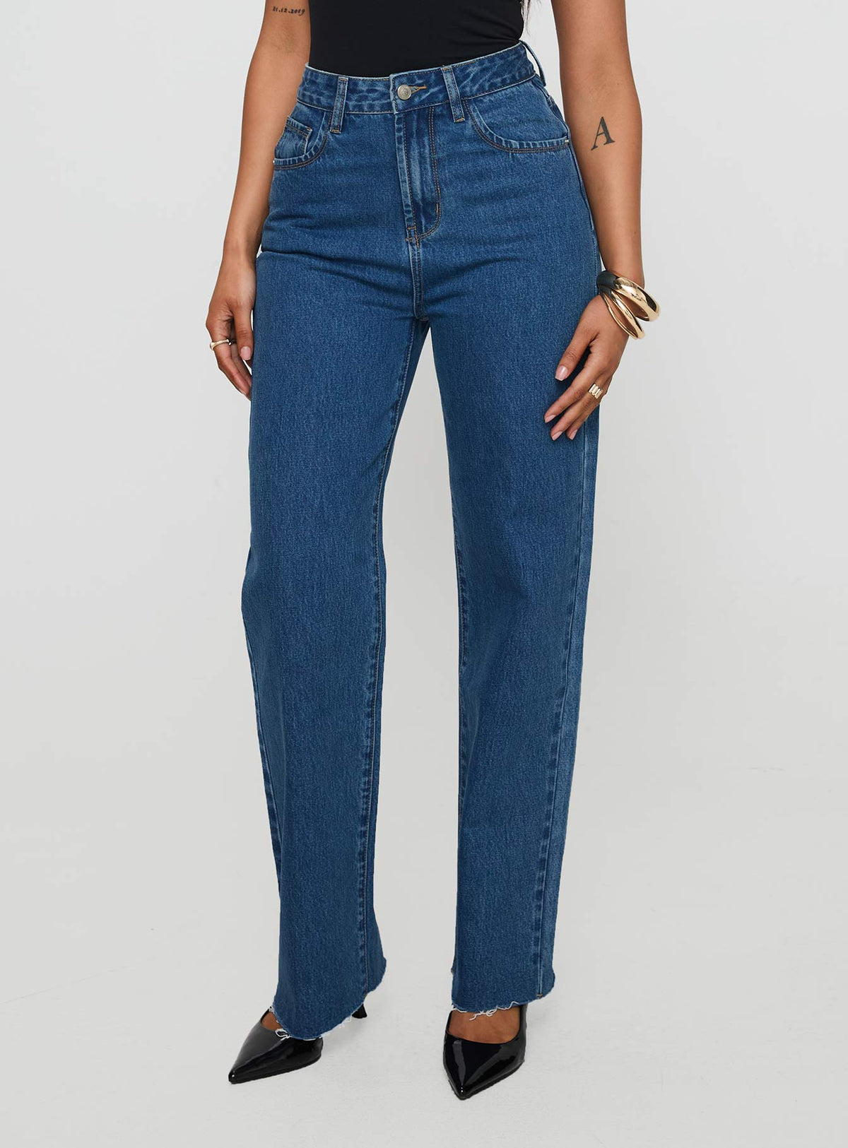 side view of model wearing Princess Polly Kalinda High Rise Straight Leg Jeans Mid Blue High Rise Jeans Jeans 