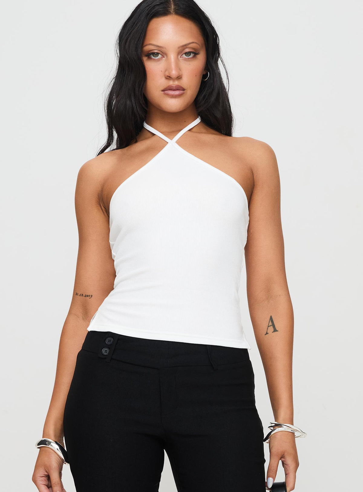 front view of model wearing Princess Polly Baseline Halter Rib Top White Sleeveless 