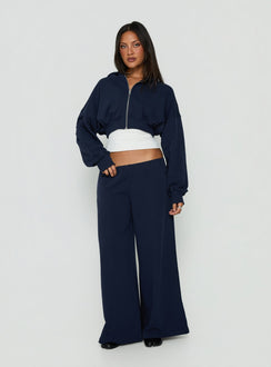 Showcasing the Kaeya Fleece Wide Leg Low Rise Pants Navy in womens regular pants with low-rise front view of model wearing Princess Polly