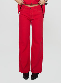front view of model wearing Princess Polly Top Model Jeans Red Mid Rise Jeans Jeans 