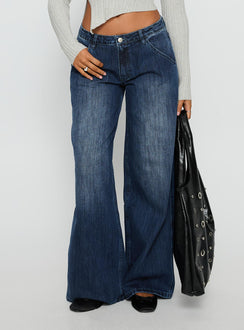 back view of model wearing Princess Polly Downtowner Low Rise Cargo Jeans Mid Blue Wash Low Rise Jeans Jeans 