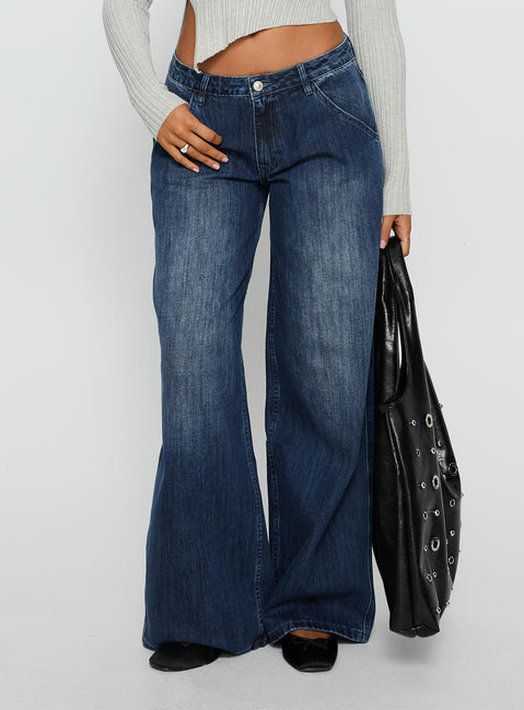 back view of model wearing Princess Polly Downtowner Low Rise Cargo Jeans Mid Blue Wash Low Rise Jeans Jeans 