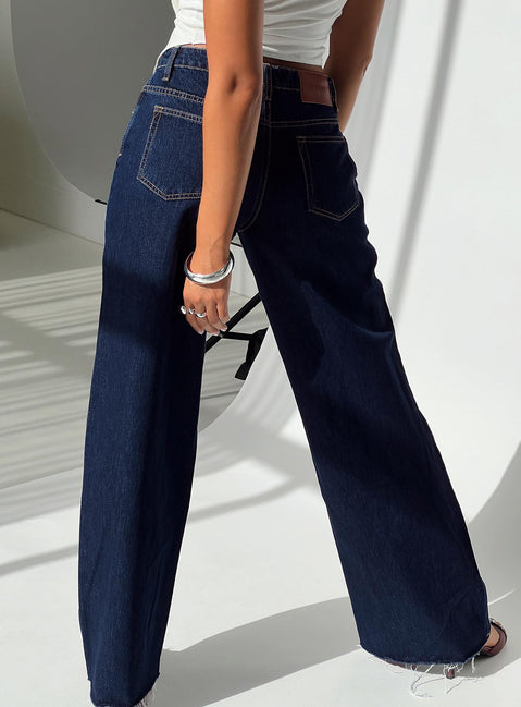 back view of model wearing Princess Polly Darla Low Rise Straight Jean Dark Wash Petite Low Rise Jeans 