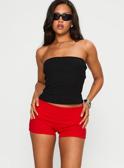 back view of model wearing Princess Polly Baseline Low Rise Rib Shorts Red Low Rise Shorts 