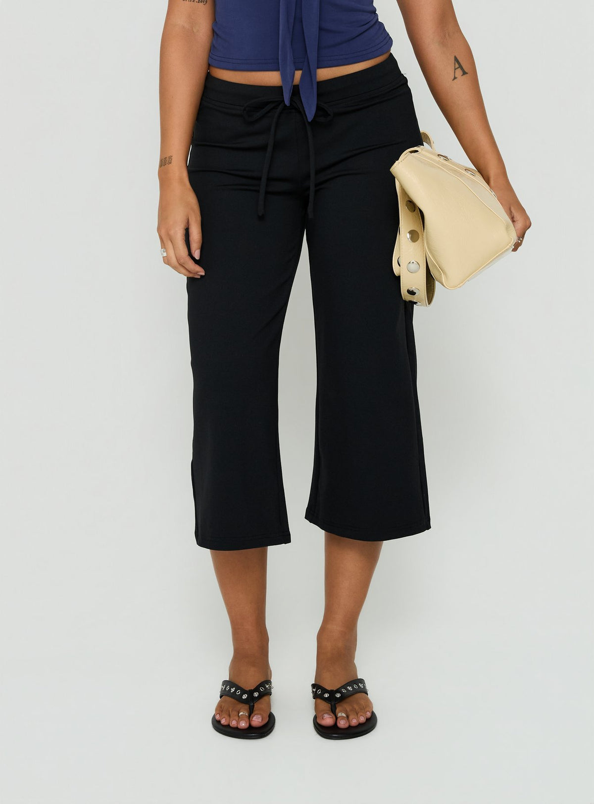 Crafted from Kallora Low Rise Wide Leg Capris Black womens-regular-pants detail view of model wearing Princess Polly