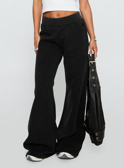 side view of model wearing Princess Polly Summits Flared Track Pants Washed Black High Rise Pants Pants 