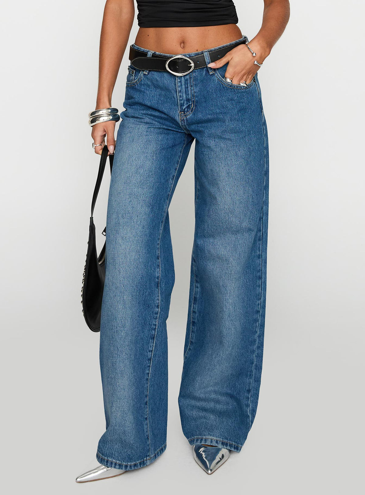 side view of model wearing Princess Polly On Sunset Mid Rise Straight Leg Jeans Dark Wash Mid Rise Jeans Jeans 