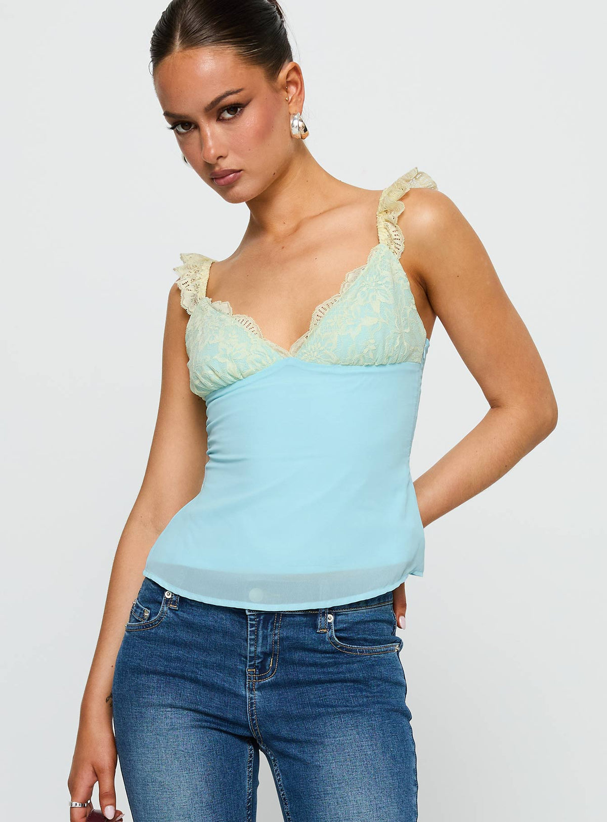 front view of model wearing Princess Polly Delvonte Top Blue / Yellow Sleeveless V-Neck 
