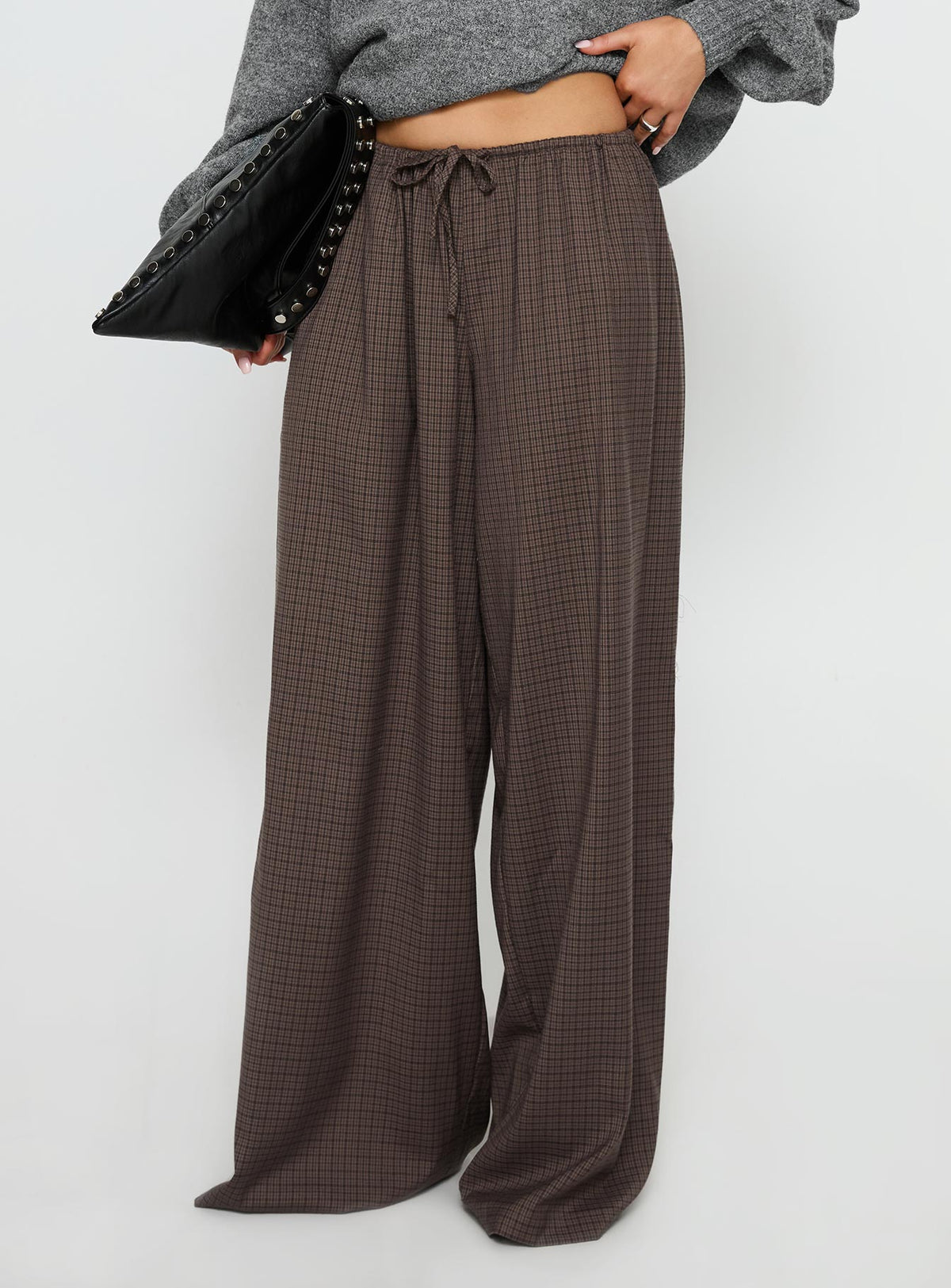 side view of model wearing Princess Polly Bungala Oversized Relaxed Pants Brown Check Mid Rise Pants Pants 